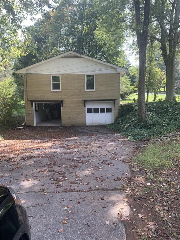 529 Hawkins Store Road Northeast Kennesaw, GA 30144 - Photo 5 of 18 a house view with a backyard space