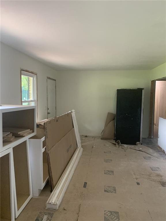 529 Hawkins Store Road Northeast Kennesaw, GA 30144 - Photo 8 of 18 a view of workspace with flat screen tv