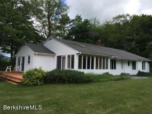 281 Whitman Road Hancock, MA 01267 - Photo 3 of 15 a front view of a house with a garden