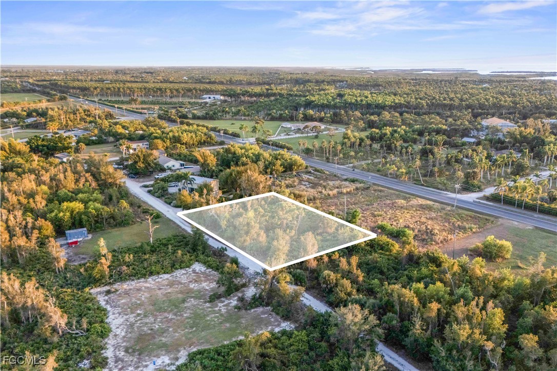 13721 Hampton Road Bokeelia, FL 33922 - Photo 3 of 9 an aerial view of residential houses with outdoor space
