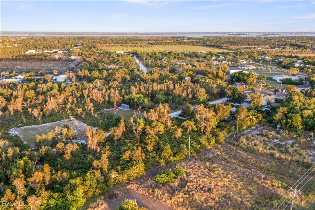 13721 Hampton Road Bokeelia, FL 33922 - Photo 6 of 9 an aerial view of residential building and lake