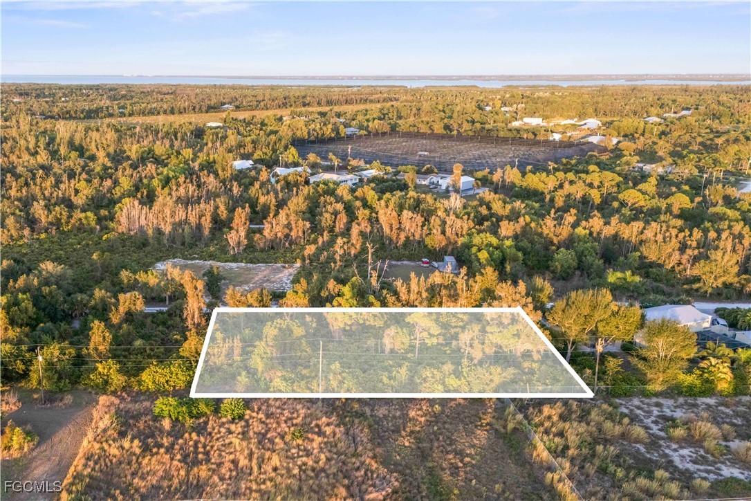 13721 Hampton Road Bokeelia, FL 33922 - Photo 7 of 9 an aerial view of residential houses with outdoor space