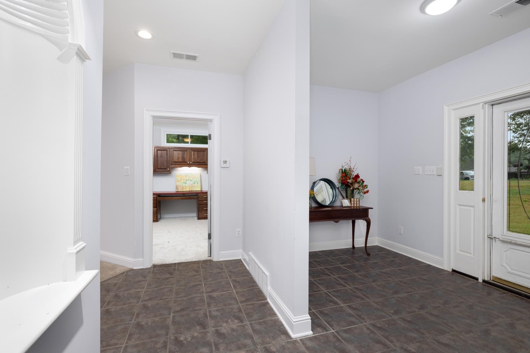 5798 North Sunset Point Memphis, TN 38135 - Photo 15 of 40 a view of a hallway to a livingroom and a livingroom with furniture