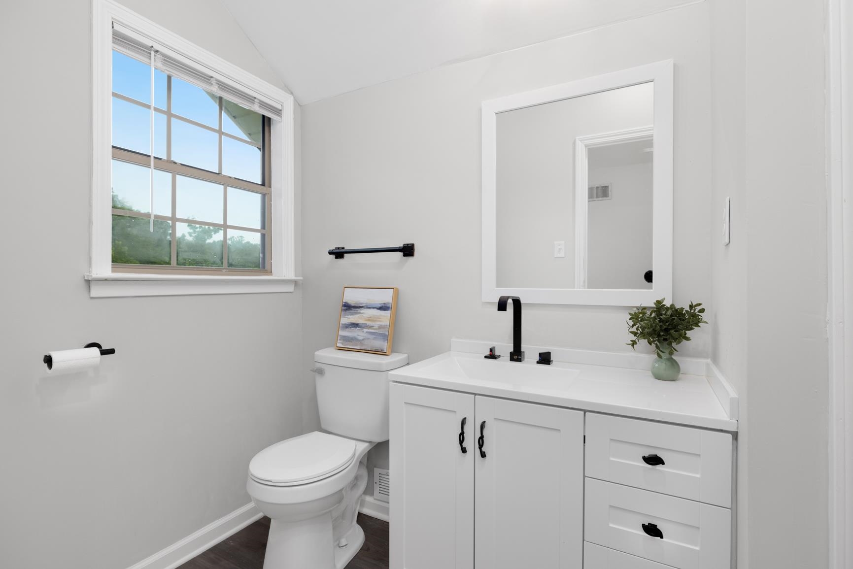 5798 North Sunset Point Memphis, TN 38135 - Photo 28 of 40 a bathroom with a toilet a sink and a mirror