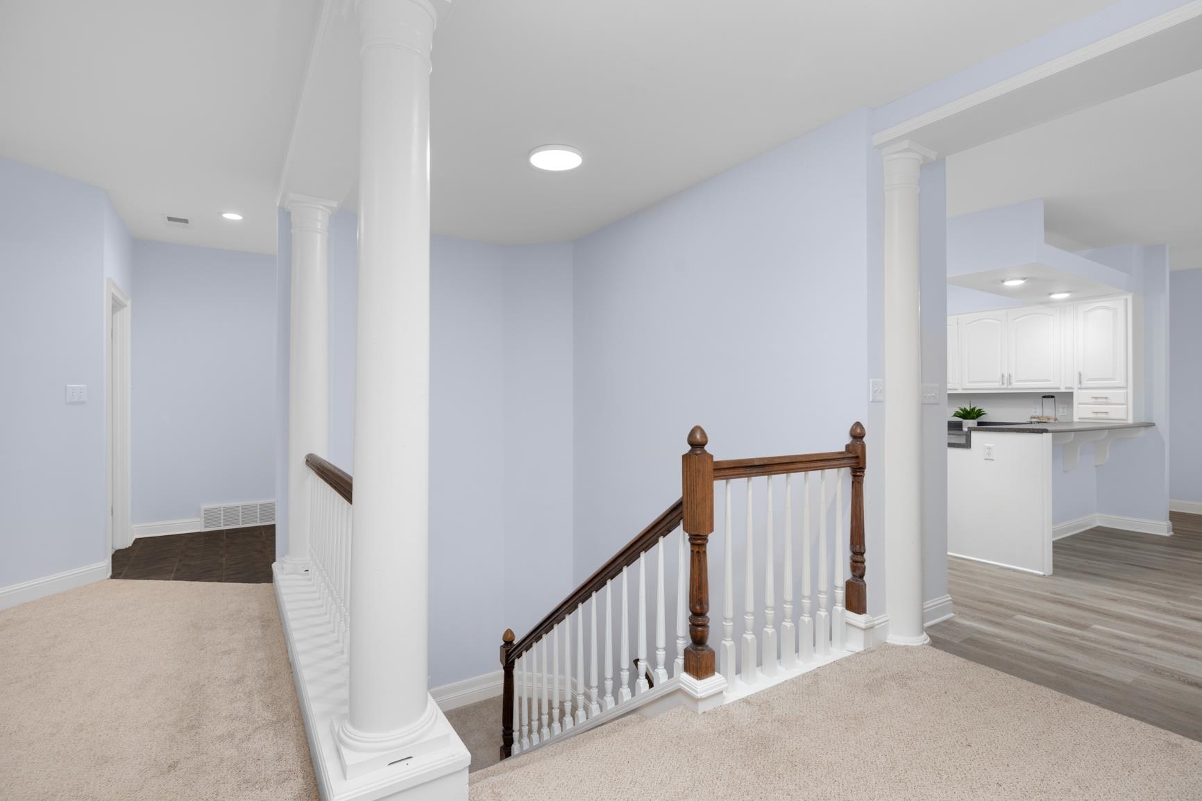5798 North Sunset Point Memphis, TN 38135 - Photo 31 of 40 a view of a hallway with wooden floor and staircase