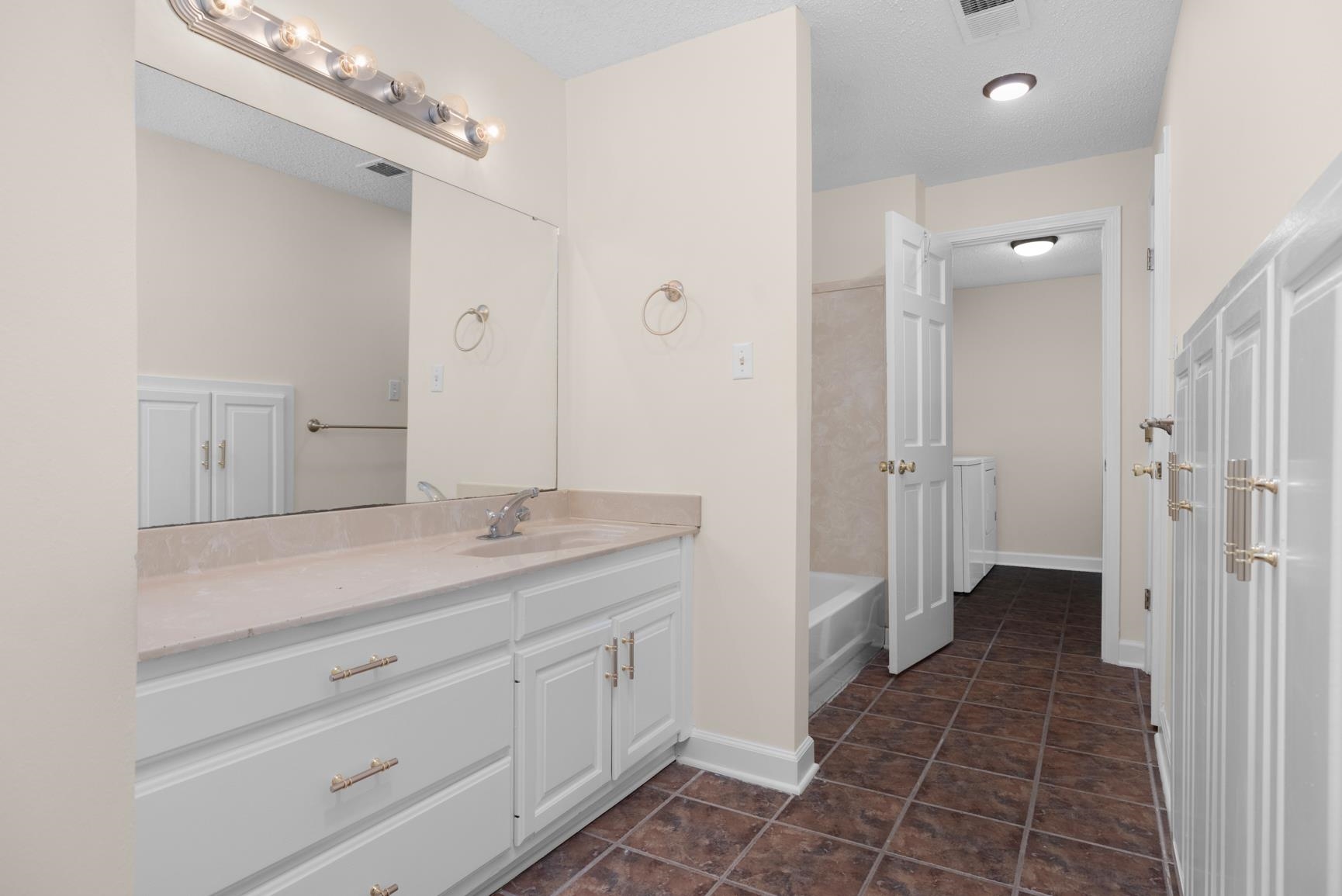 5798 North Sunset Point Memphis, TN 38135 - Photo 37 of 40 a spacious bathroom with a granite countertop sink a toilet and a shower