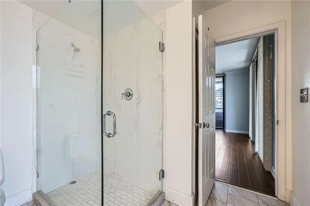 a view of a bathroom from a hallway