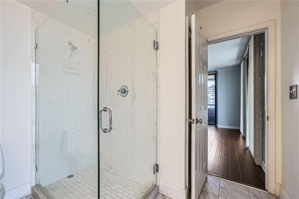 3481 Lakeside Drive Northeast, Unit 1107 Atlanta, GA 30326 - Photo 19 of 35 a view of a bathroom from a hallway