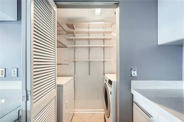 a bathroom with a tub and shower
