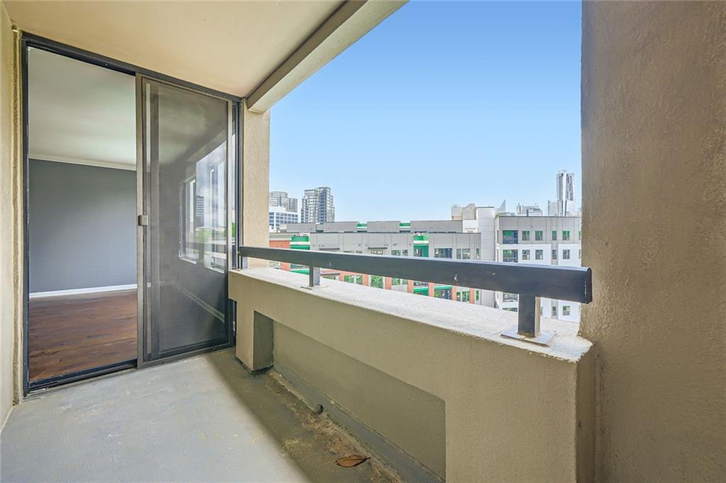 3481 Lakeside Drive Northeast, Unit 1107 Atlanta, GA 30326 - Photo 28 of 35 a kitchen with a sink and a refrigerator