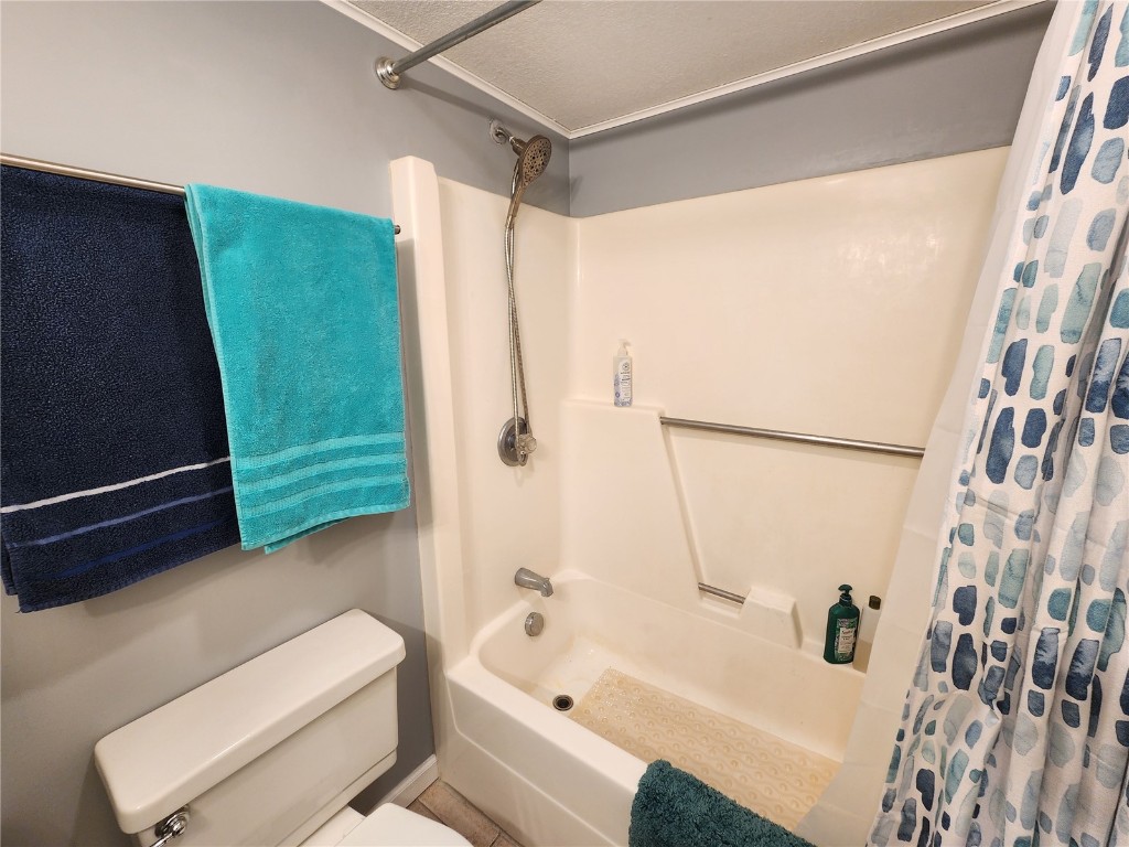 57 Copper Circle, Unit 104 Copper Mountain, CO 80443 - Photo 11 of 25 a bathroom with a shower curtain and a bathtub