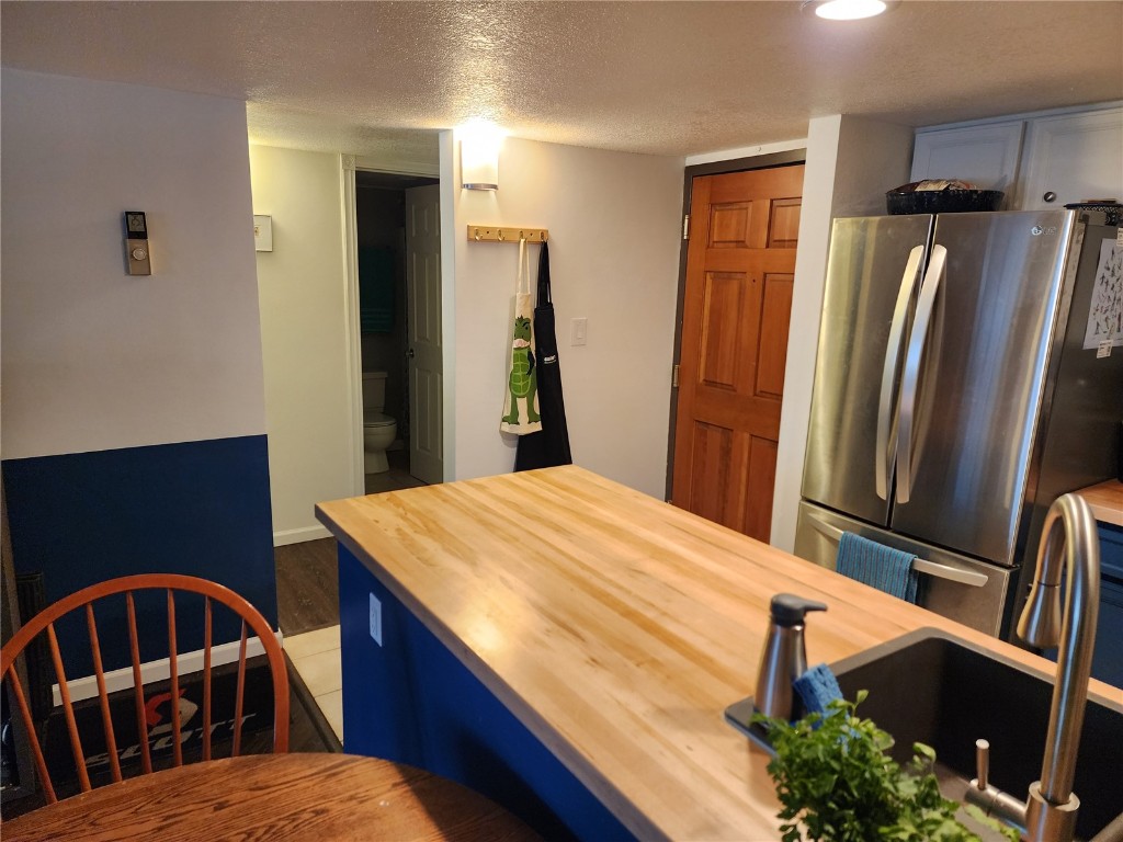 57 Copper Circle, Unit 104 Copper Mountain, CO 80443 - Photo 16 of 25 a kitchen with stainless steel appliances kitchen island a stove a refrigerator and a refrigerator
