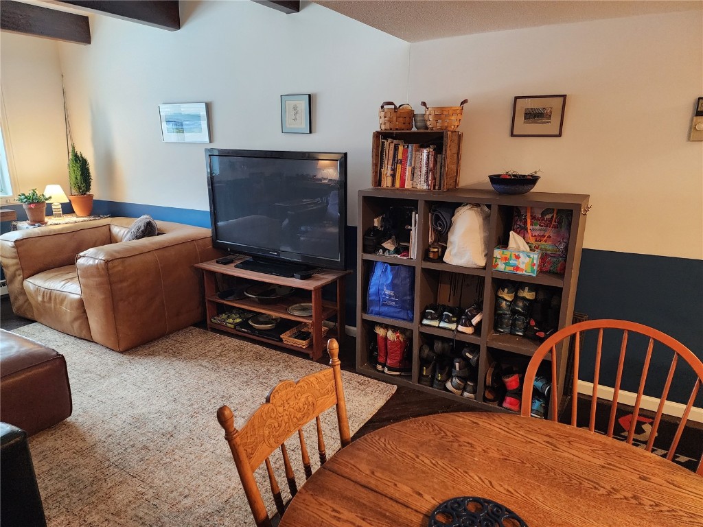 57 Copper Circle, Unit 104 Copper Mountain, CO 80443 - Photo 17 of 25 a bedroom with furniture and a book shelf