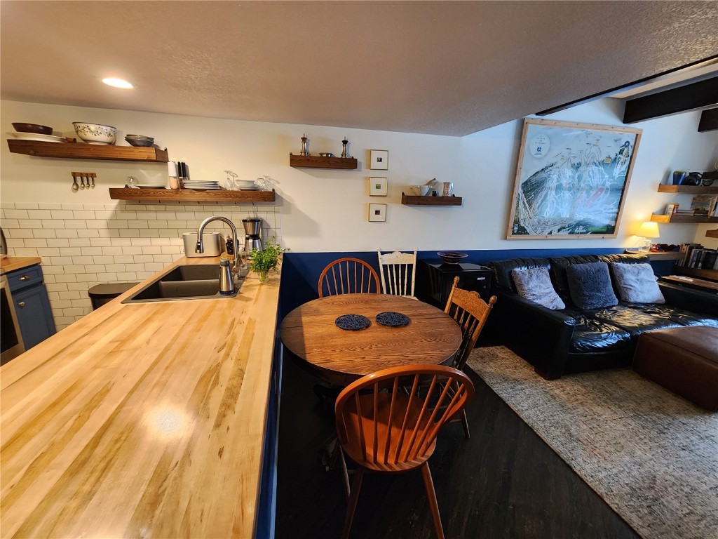 57 Copper Circle, Unit 104 Copper Mountain, CO 80443 - Photo 5 of 25 a bedroom with furniture and a bed