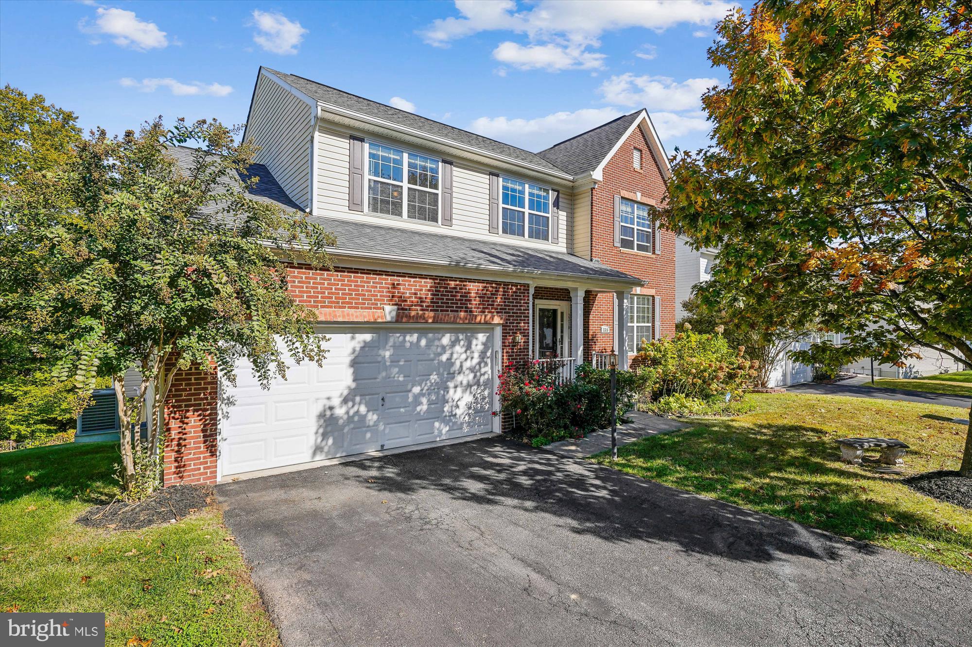 3318 Eagle Ridge Drive Woodbridge, VA 22191 - Photo 2 of 72 a front view of a house with a yard and a garage