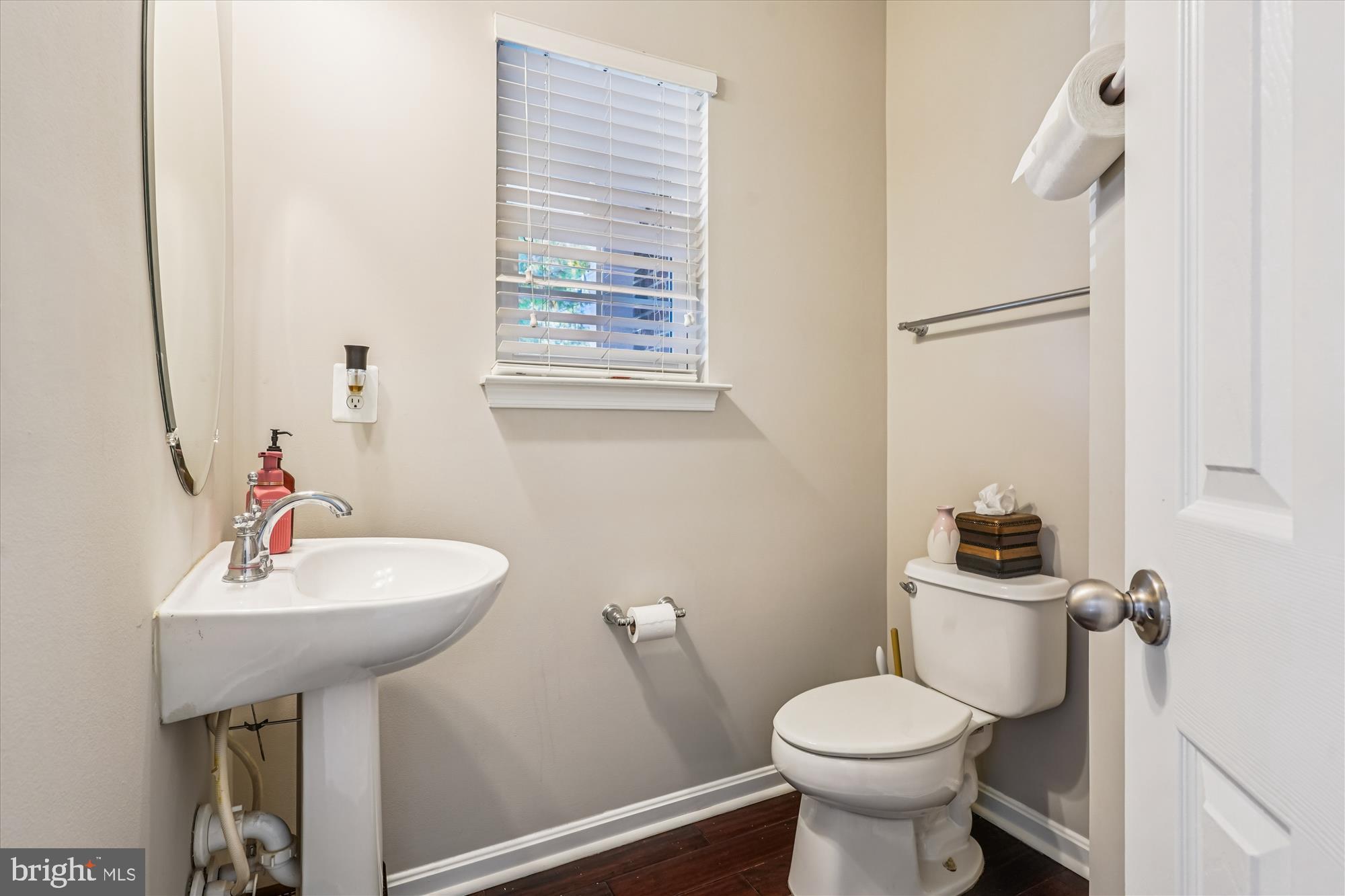 3318 Eagle Ridge Drive Woodbridge, VA 22191 - Photo 23 of 72 a bathroom with a sink toilet and a mirror