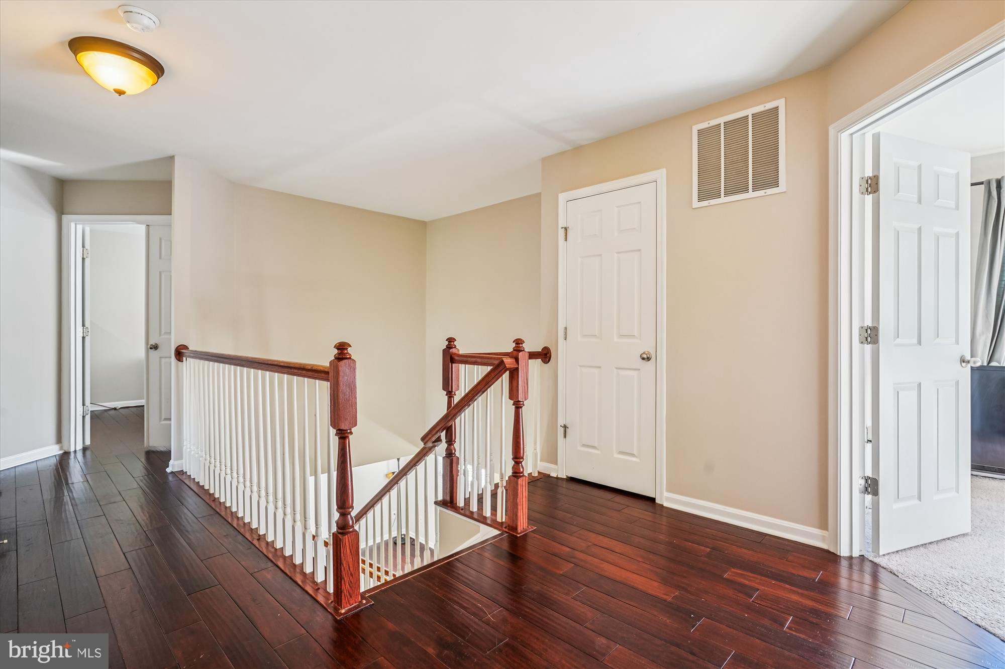 3318 Eagle Ridge Drive Woodbridge, VA 22191 - Photo 24 of 72 a view of a hallway with wooden floor and stairs