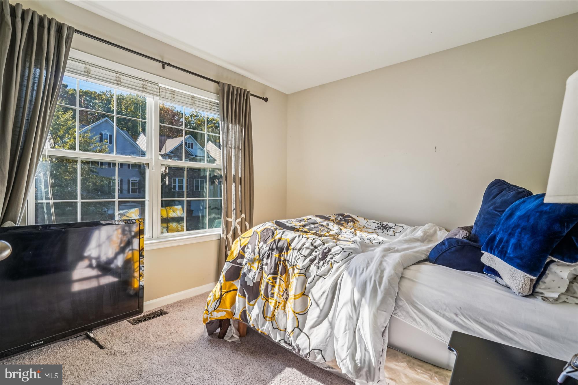 3318 Eagle Ridge Drive Woodbridge, VA 22191 - Photo 25 of 72 a bed sitting in a bedroom next to a window