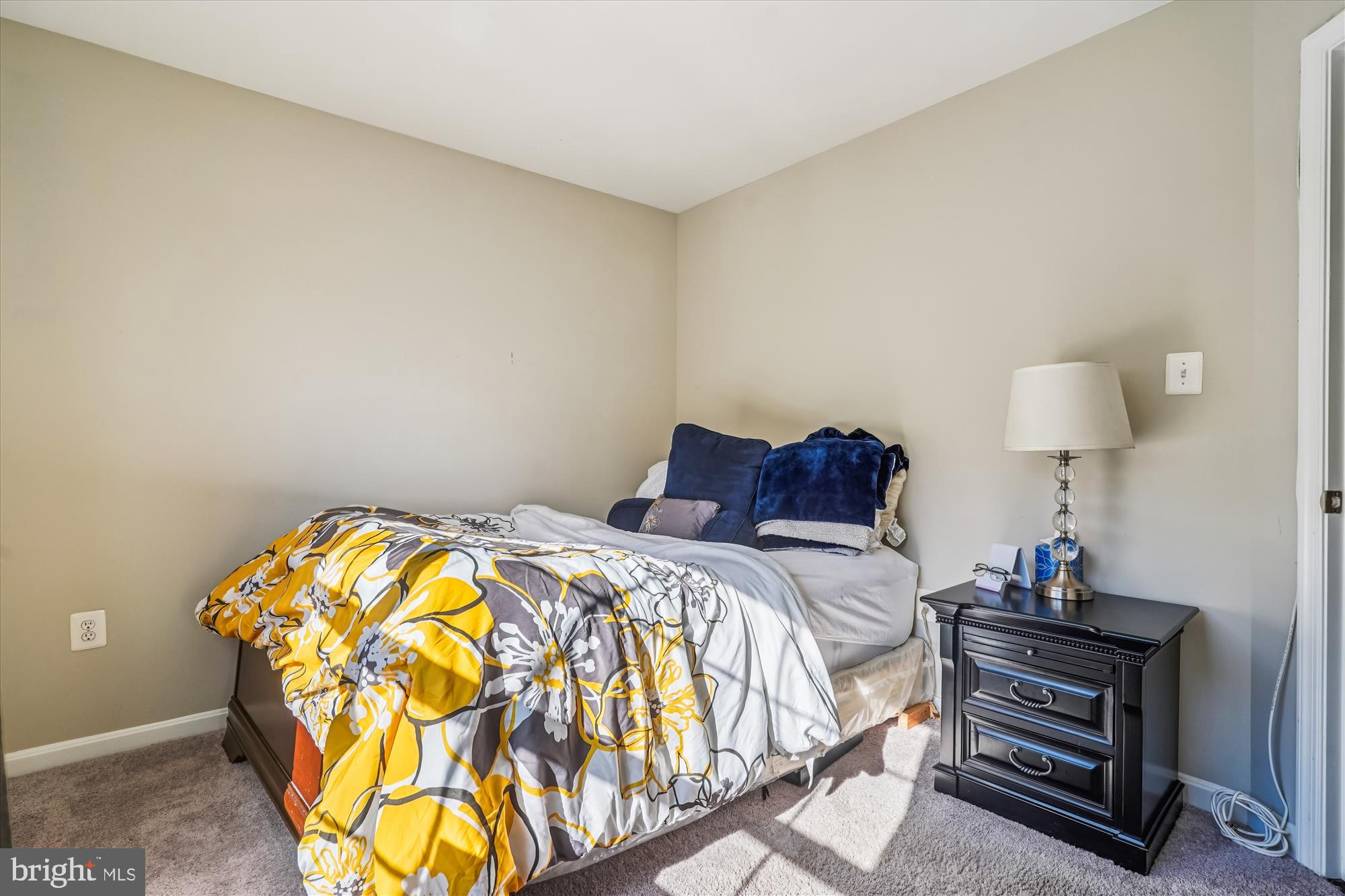 3318 Eagle Ridge Drive Woodbridge, VA 22191 - Photo 27 of 72 a bedroom with a bed and a lamp on dresser