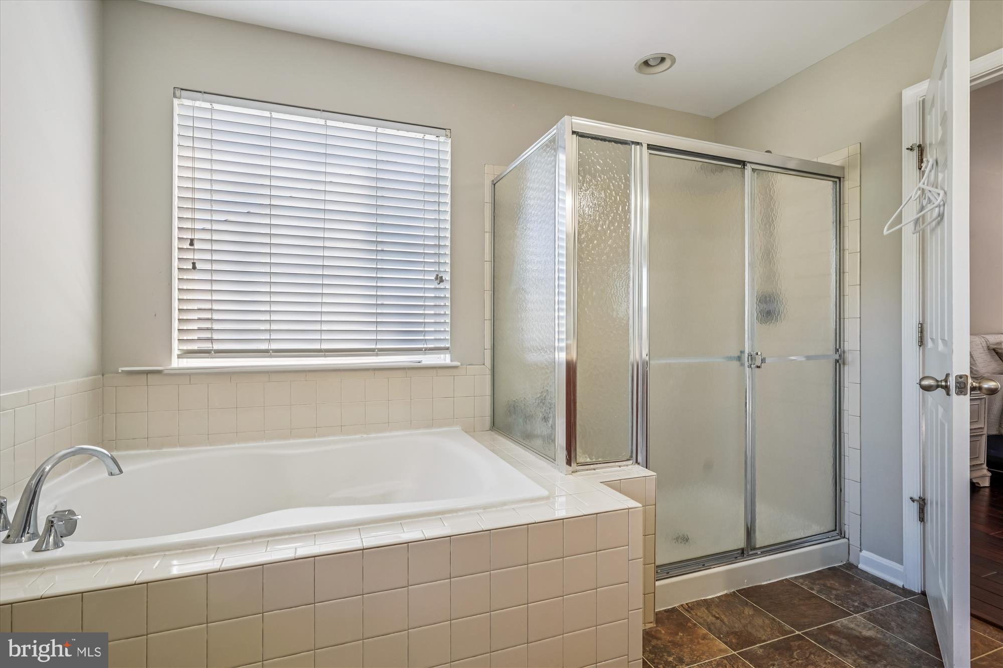 3318 Eagle Ridge Drive Woodbridge, VA 22191 - Photo 40 of 72 a bathroom with a bathtub and a shower