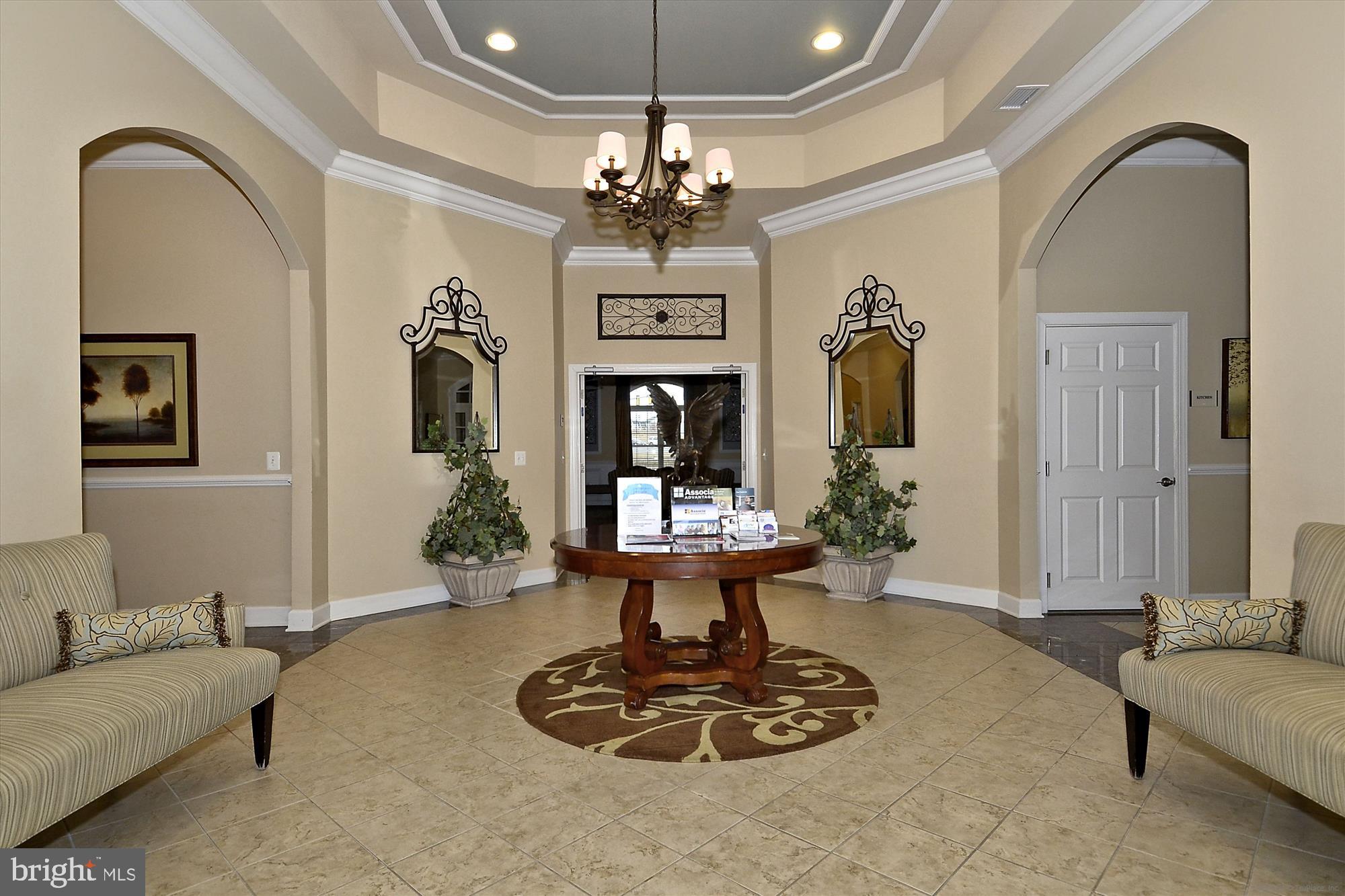 3318 Eagle Ridge Drive Woodbridge, VA 22191 - Photo 60 of 72 a living room with furniture a chandelier and a chandelier