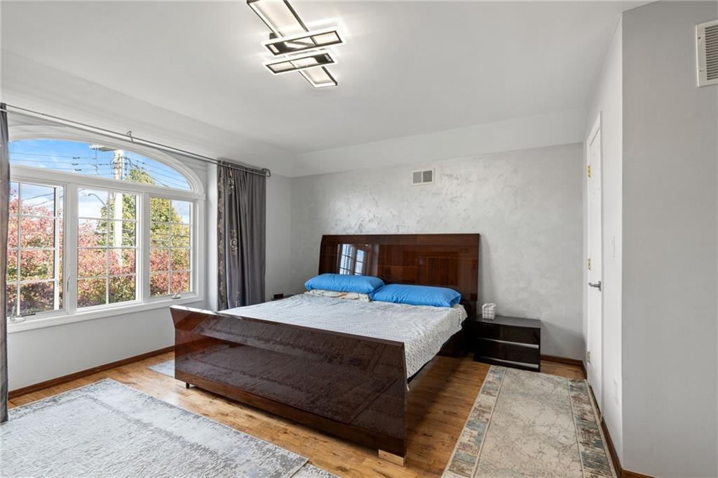 1314 East 69th Street Brooklyn, NY 11234 - Photo 17 of 42 a bedroom with a bed and window