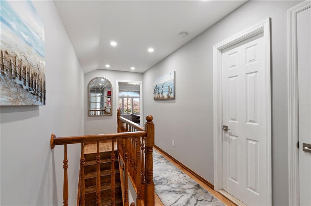 1314 East 69th Street Brooklyn, NY 11234 - Photo 21 of 42 a view of a hallway with wooden floor and stairs