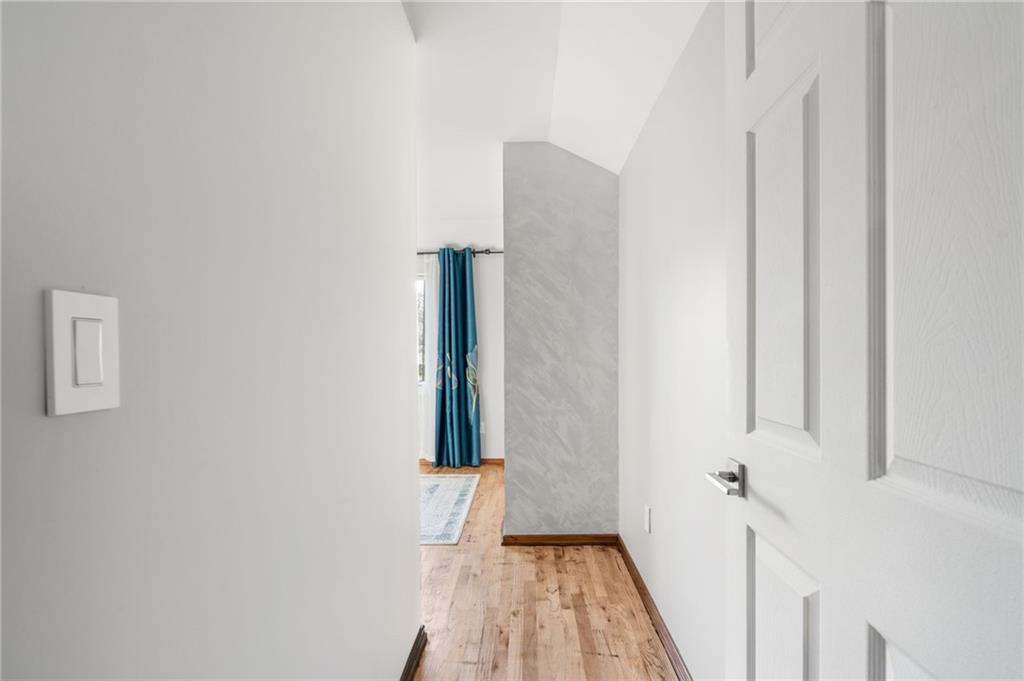 1314 East 69th Street Brooklyn, NY 11234 - Photo 24 of 42 a view of an empty room with wooden floor and a window