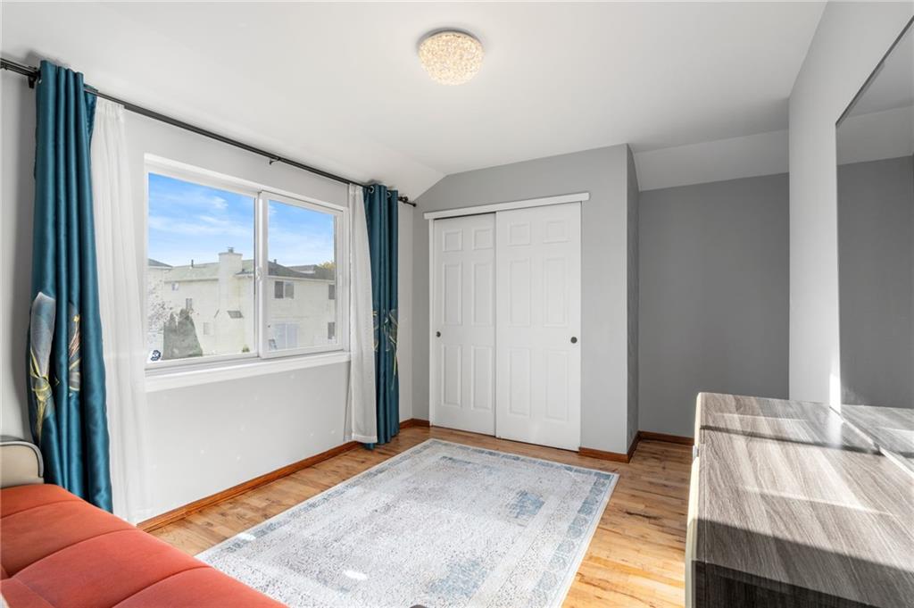 1314 East 69th Street Brooklyn, NY 11234 - Photo 26 of 42 a bedroom with a bed and a window