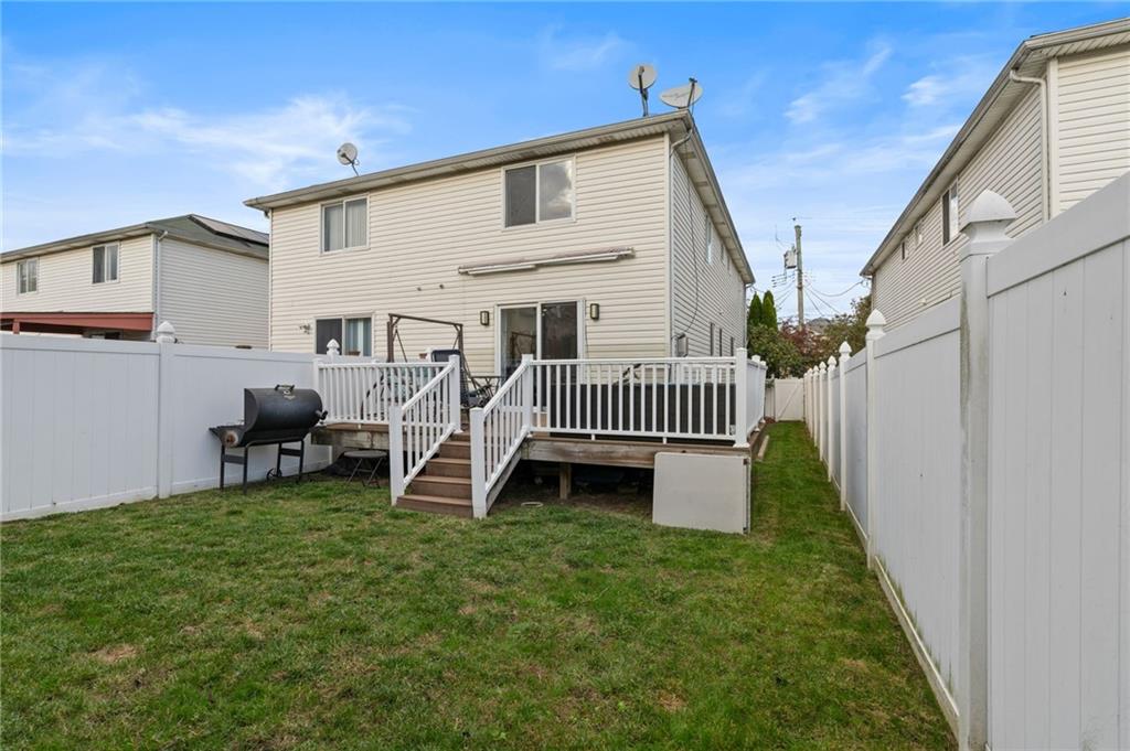 1314 East 69th Street Brooklyn, NY 11234 - Photo 38 of 42 a view of a house with a yard and deck