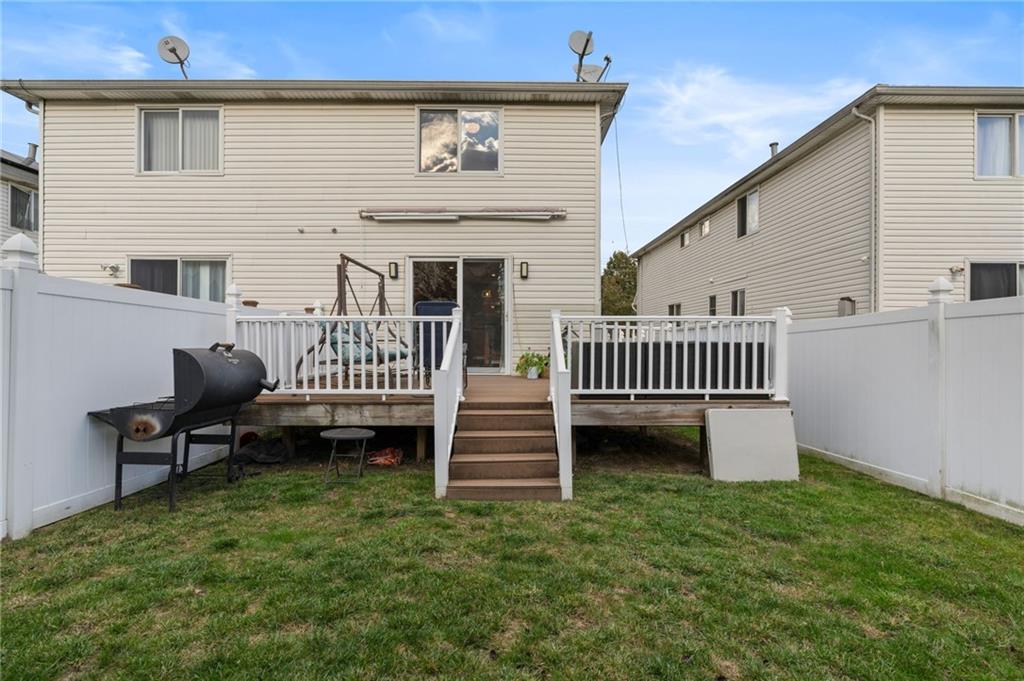 1314 East 69th Street Brooklyn, NY 11234 - Photo 39 of 42 a view of a house with a yard and deck