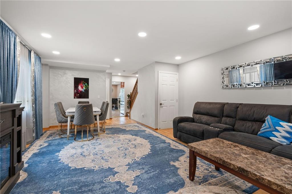 1314 East 69th Street Brooklyn, NY 11234 - Photo 4 of 42 a living room with furniture rug and wooden floor