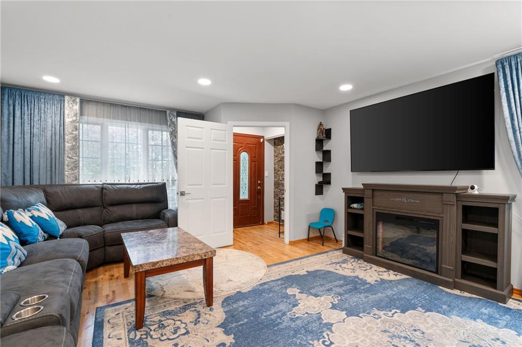 1314 East 69th Street Brooklyn, NY 11234 - Photo 6 of 42 a living room with furniture and a flat screen tv