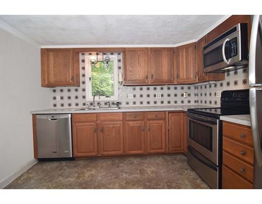 35 Cornell Road Westport, MA 02790 - Photo 11 of 38 a kitchen with kitchen island granite countertop a sink window and cabinets