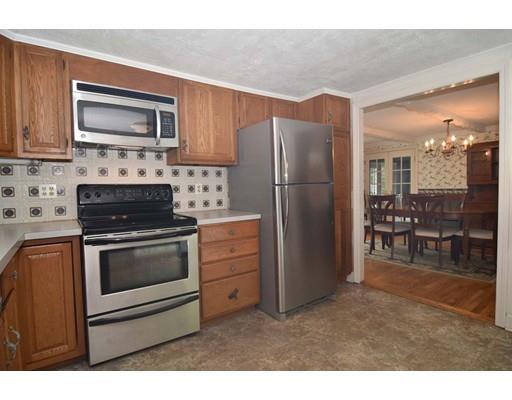 35 Cornell Road Westport, MA 02790 - Photo 13 of 38 a kitchen with granite countertop a refrigerator stove and microwave