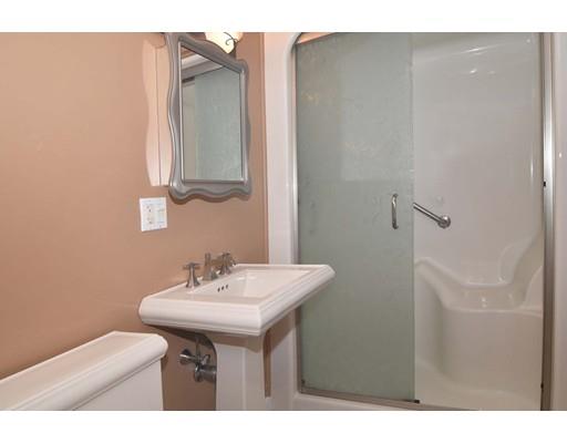 35 Cornell Road Westport, MA 02790 - Photo 25 of 38 a bathroom with a sink a mirror and a vanity