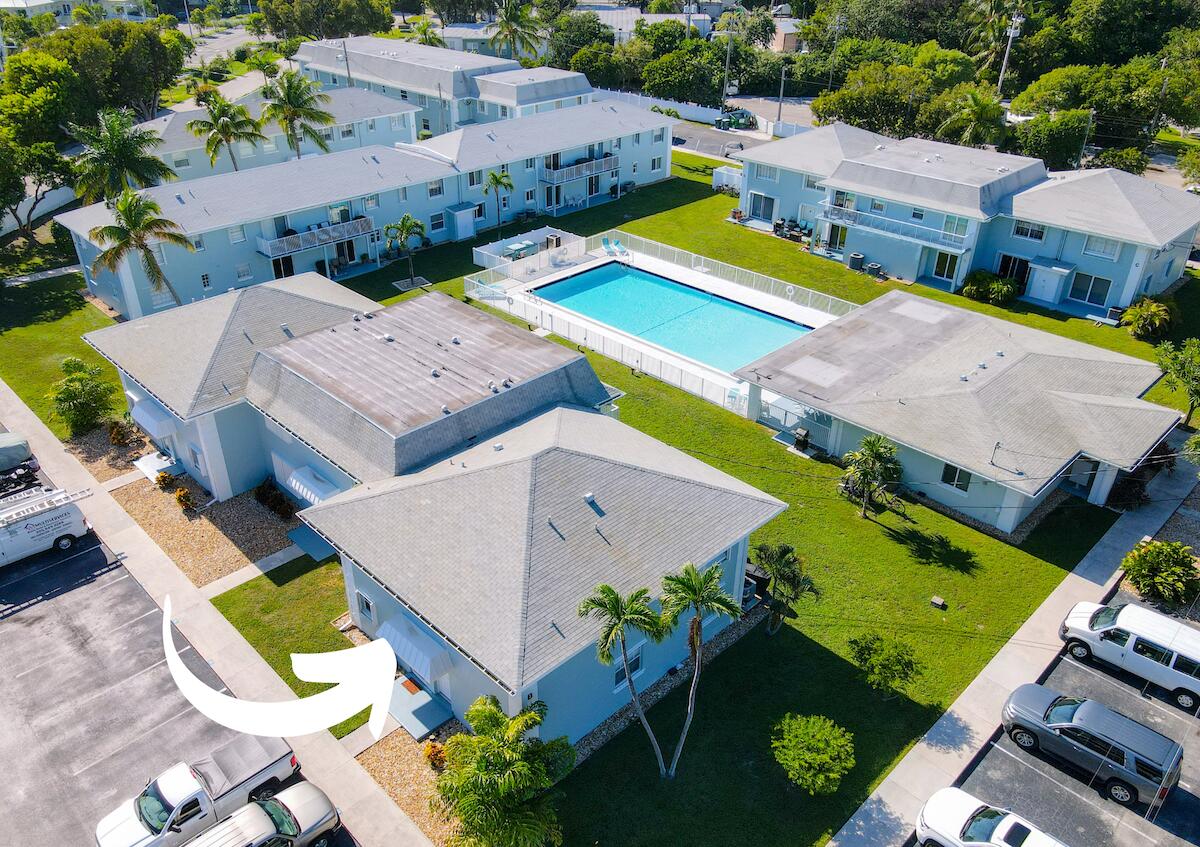 40 High Point Road, Unit B102 Tavernier, FL 33070 - Photo 3 of 27 an aerial view of a house with yard swimming pool and outdoor seating