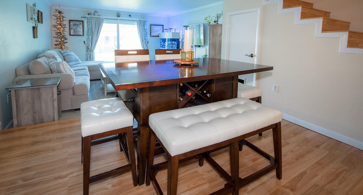 40 High Point Road, Unit B102 Tavernier, FL 33070 - Photo 9 of 27 a view of a dining room with furniture and wooden floor