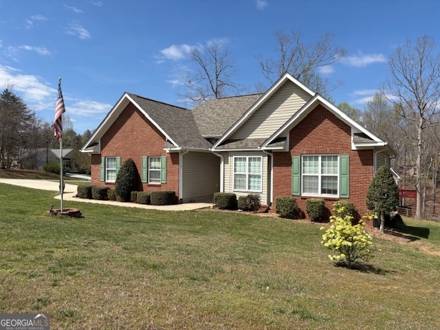 a front view of a house with a garden and porch