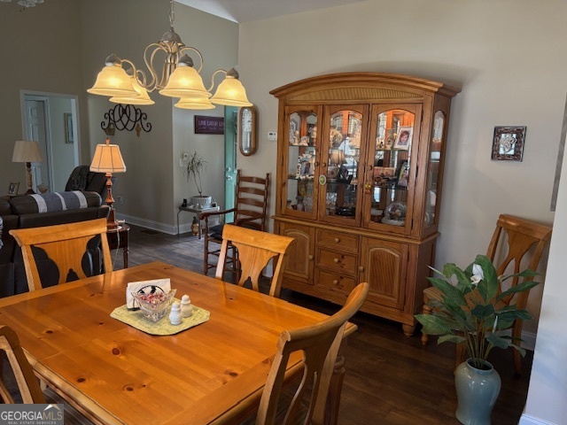 610 Birch Lane Clarkesville, GA 30523 - Photo 17 of 46 a view of a dining room with furniture a chandelier and wooden floor