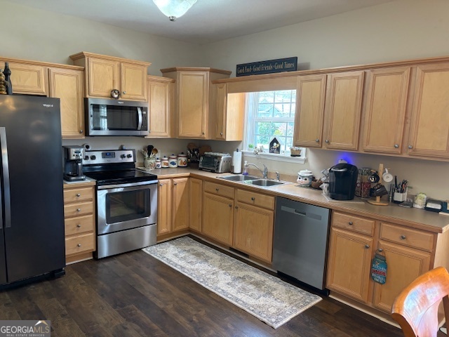 610 Birch Lane Clarkesville, GA 30523 - Photo 19 of 46 a kitchen with a sink cabinets stainless steel appliances and a window