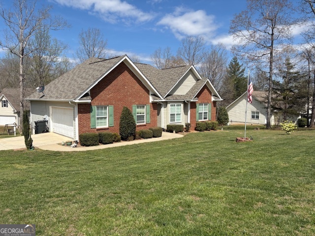 610 Birch Lane Clarkesville, GA 30523 - Photo 2 of 46 a front view of a house with a garden