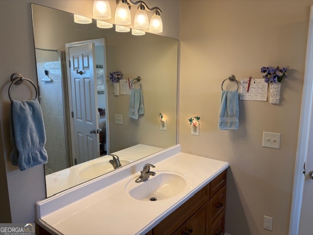 610 Birch Lane Clarkesville, GA 30523 - Photo 30 of 46 a bathroom with a sink vanity and a mirror