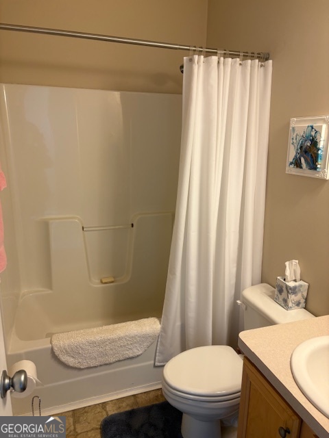 610 Birch Lane Clarkesville, GA 30523 - Photo 40 of 46 a white toilet sitting next to a bathroom sink