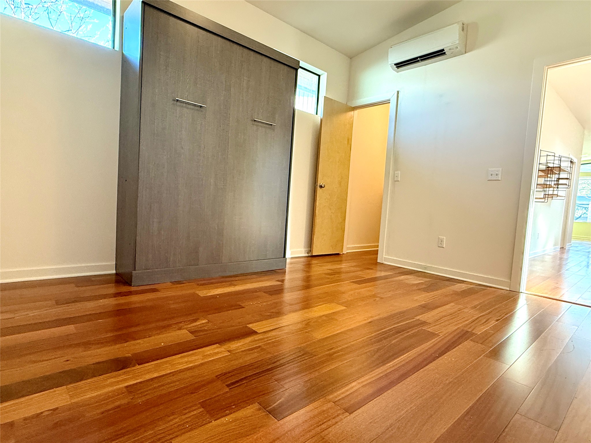 416 Starlight Village Loop Leander, TX 78641 - Photo 1 of 28 Unfurnished bedroom featuring a closet, vaulted ceiling, and light wood-type flooring