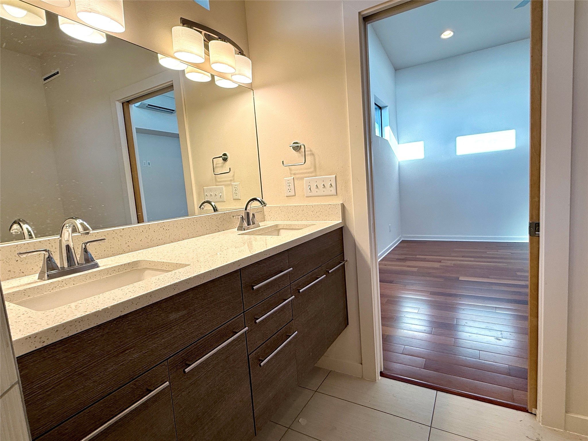 416 Starlight Village Loop Leander, TX 78641 - Photo 21 of 28 Bathroom featuring double vanity, recessed lighting, and light tile patterned flooring