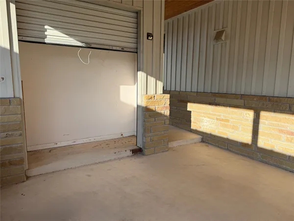 an empty room with wooden floor and closet