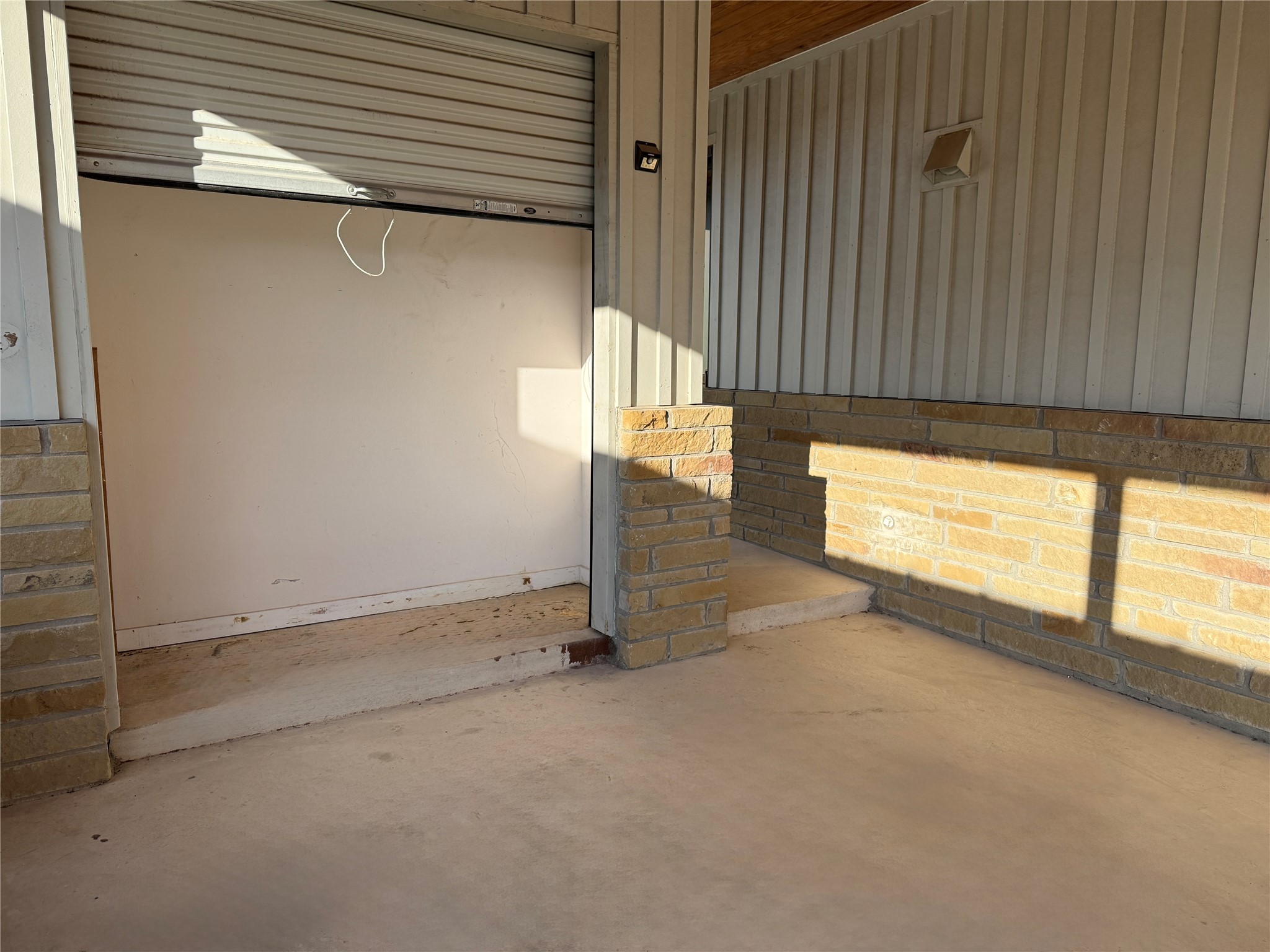 416 Starlight Village Loop Leander, TX 78641 - Photo 22 of 28 Garage with baseboards and wood walls