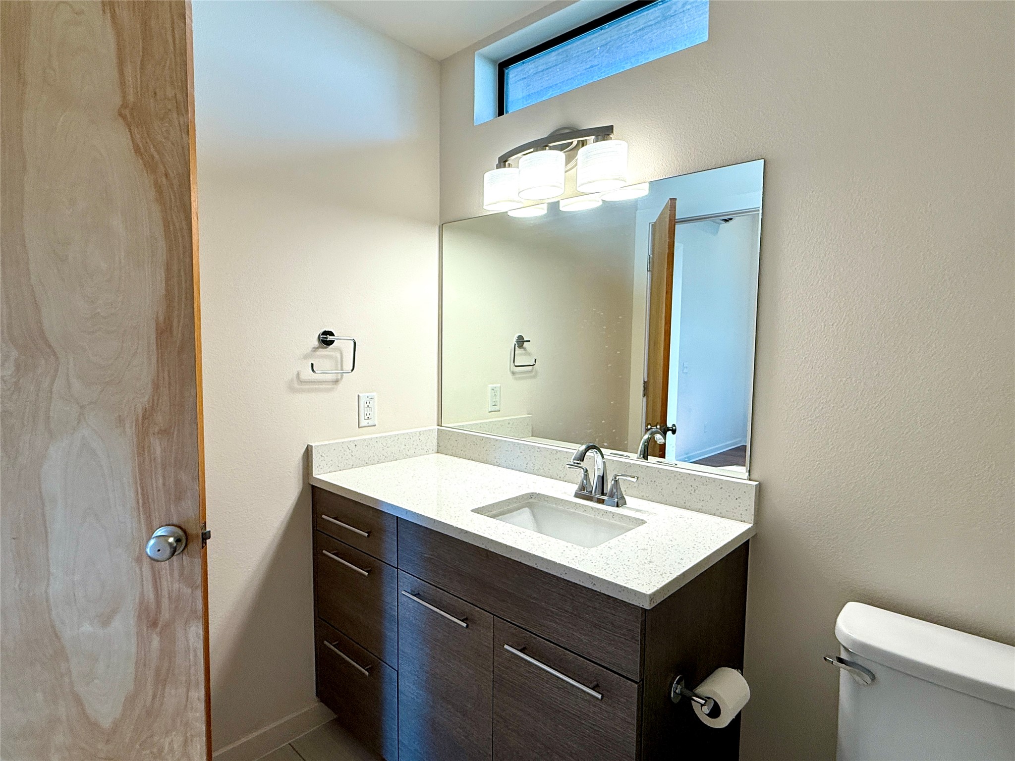 416 Starlight Village Loop Leander, TX 78641 - Photo 24 of 28 Half bathroom with vanity and a textured wall