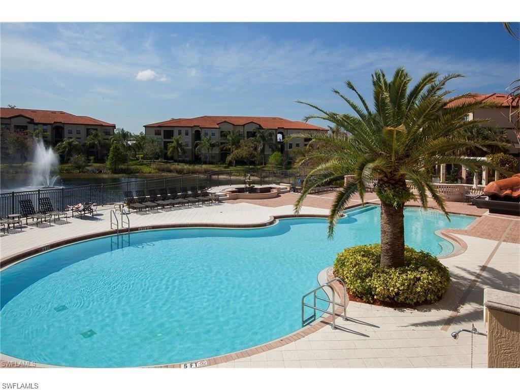 12975 Positano Circle, Unit 202 Naples, FL 34105 - Photo 11 of 14 a swimming pool with barbeque oven
